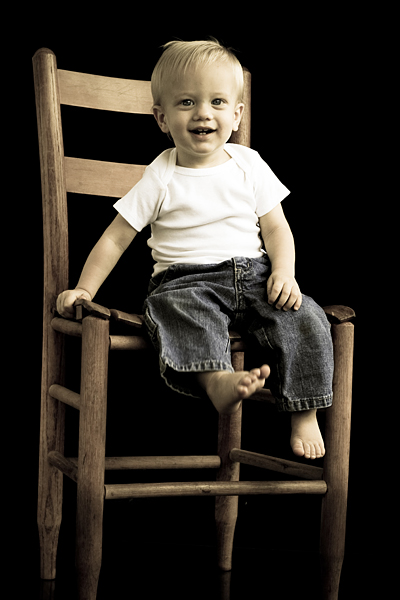 Little man in a big chair