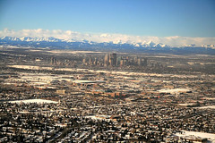 Calgary's suburbs in the foreground, downtown in the background (by: ShazzMack, creative commons license)