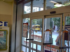 A view out of the Walgreen's Drug Store window of an approaching Memphis Main Street trolley car. Memphis Tennesee. September 2007.