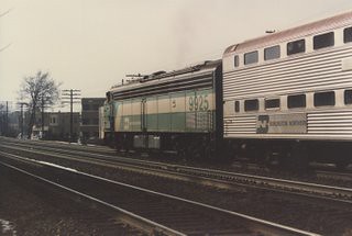 Westbound Metra / Burlington Northern commuter train. La Grange Illinois. Febuary 1986.
