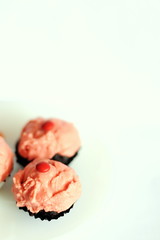 Mini cupcakes pretending to be strawberry ice-cream sundaes
