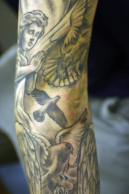 Doves-and-Cherub Tattoo. Tattooed by Ray at The Tattoo Studio, Crayford