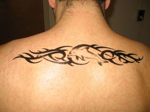 tribal tattoo upper back. Dolphin Tribal Tattoo Design