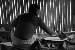 Villager making Flatbread from Yuca