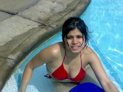 Hot Indian woman Sonya Agarwal in bikini in a swimming pool