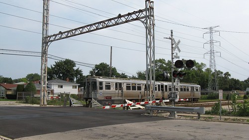 Westbound CTA Yellow line / Skokie Swift train at the Kostner Avenue railroad crossing. Skokie Illinois. August 2008. by Eddie from Chicago