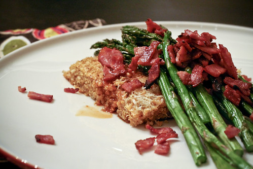 quinoa cake with asparagus and bacon bits