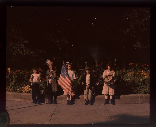 Children in costumes with flags at Jones Park