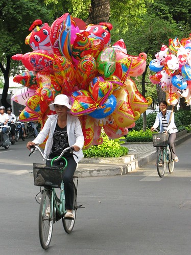 Balloon vendors on bikes - Saigon, Vietnam