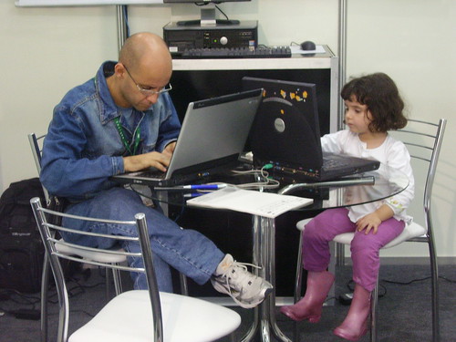 Man and child using their laptops