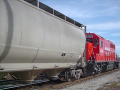 A bright red EMD switcher on a CP Rail switching local. Franklin Park Illinois. October 2007.