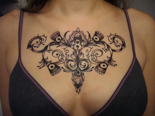 Women triangle flower decorative chest tattoo