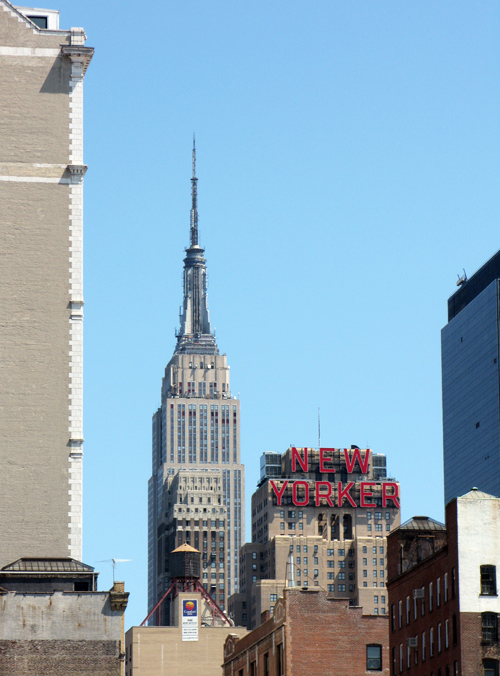 the Empire State Building and the New Yorker Hotel sign, Manhattan, NYC