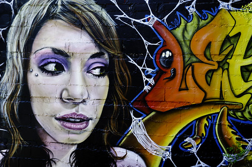 This girl was painted on the wall outside a tattoo shop in Asheville, NC.