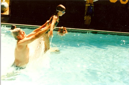 Dad throwing me in the pool at camp