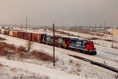 Eastbound Grand Trunk Western freight train waiting to depart from the Belt Railway of Chicago, Clearing Yard. Chicago Illinois. January 1987.