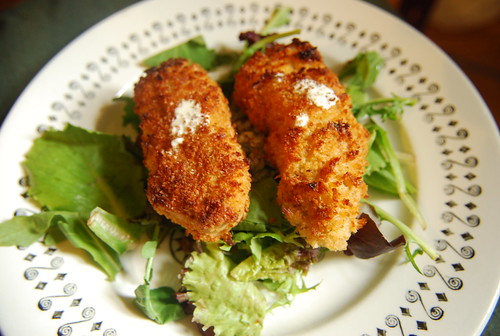 Salmon croquettes with pickle aioli on greens