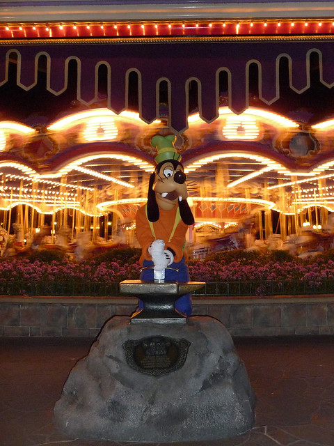 Goofy tries to pull the sword from the stone