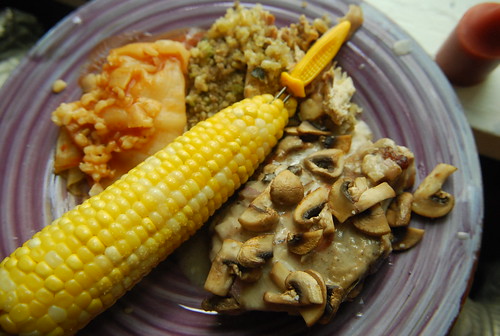 Leftover stuffing, cabbage roll, pork chop and corn