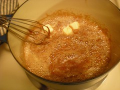 adding butter to melted sugar