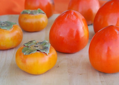 persimmons-- round Fuyus and heart-shaped Hachiyas