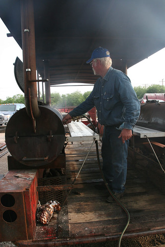 Billy fires up his mobile cooking machine to cook briskets