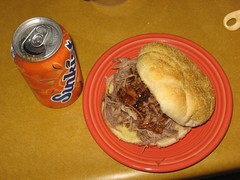 Pulled pork sandwich and orange soda