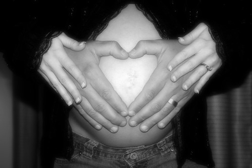  Hands of love on the belly black and white 