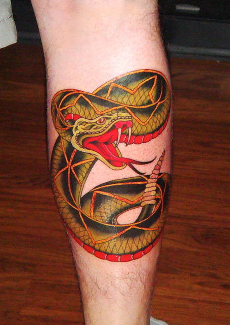 My rattlesnake calf piece. Flash is classic Sailor Jerry, tattoo done by the 