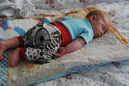 Tummy sleeper on his quilt