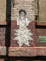Street graffiti by Feral, DUMBO, Brooklyn, NY