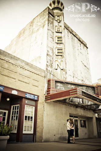 amy and todd in front of the queen movie theater engagement session bryan, tx