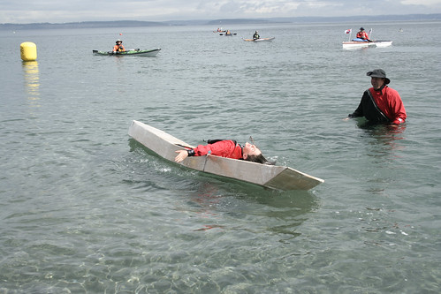 Mckinley rolling the cardboard kayak