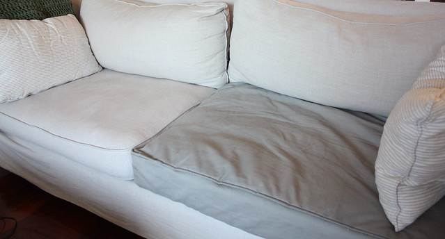 the grey cushion cover is a replacement for the fraying oatmeal ones.