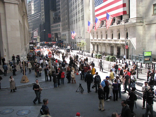 View from steps of Federal hall of crowds and security outside stock exchange