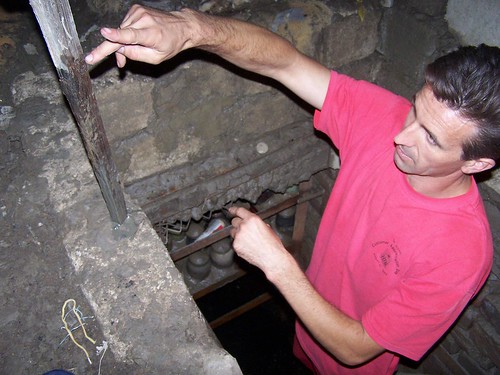 Valera showing us how much water is still in the cellar of a woman from their church