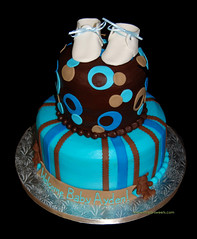 Brown, tan and blue 2 tier baby shower cake with baby booties and bears