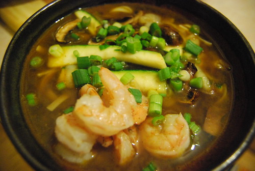 Prawn noodle soup with zucchini, porcinis and scallions