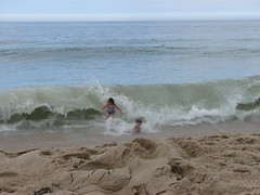 Kid crashing wave