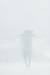 Monsoon day, a man walking in the rain