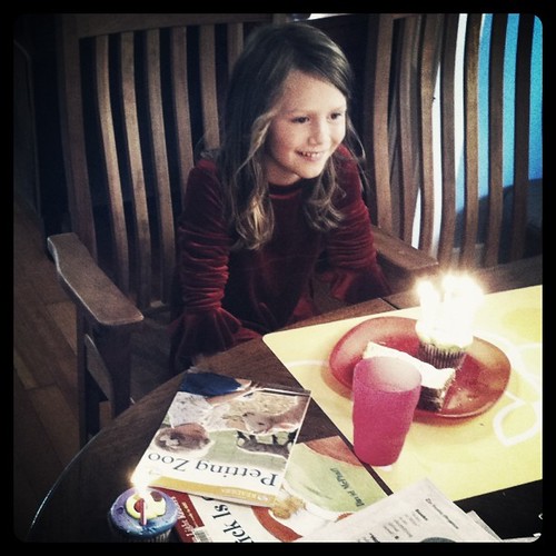 Ada enjoying "happy birthday" sung by 3 good friends (small party; everyone got a candle