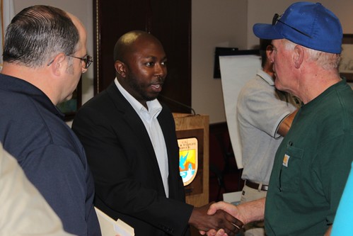 Acting Deputy Under Secretary Karis Gutter (center) meets with producers affected by the Missouri River flooding