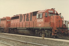 Former Detroit, Toledo & Ironton Railroad EMD road switchers idling at the Grand Trunk Western RR Elsdon Yard. ( Gone.) Chicago Illinois. June 1984.