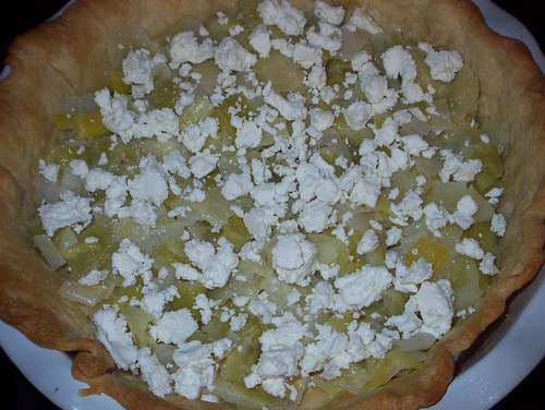 layering leeks and goat cheese in tart