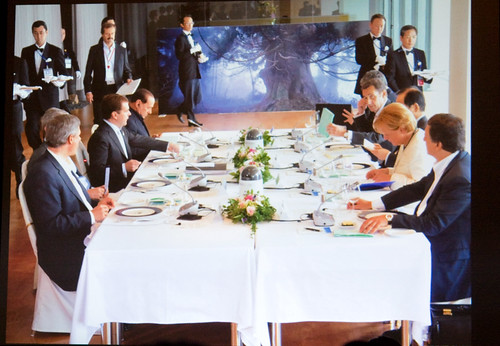G8 Summit with Amano Photo in Background
