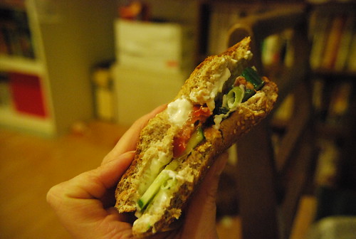 Bagel with cream cheese, cucumber and tomato