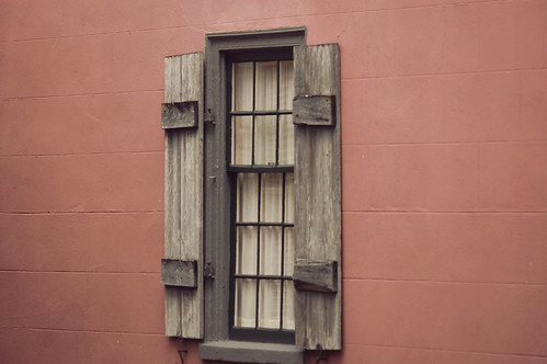 pink wall...wood shutters  
