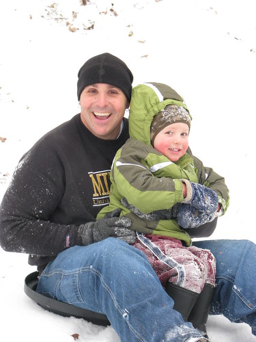 Sliding down the hill with Daddy