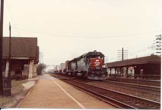 Eastbound Southern Pacific run thru piggyback train. La Grange Illinois. Febuary 1986.