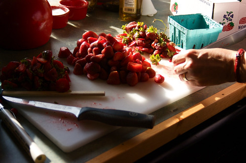 preparing strawberries for jam